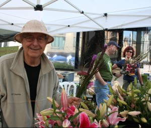 Harold Wilkins selling flowers at Mill City Farmers Market. 