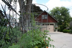 In this yard, the best spot for vegetables was next to the driveway.