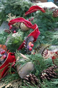 A mixture of real and artificial elements give this wreath pizzazz.