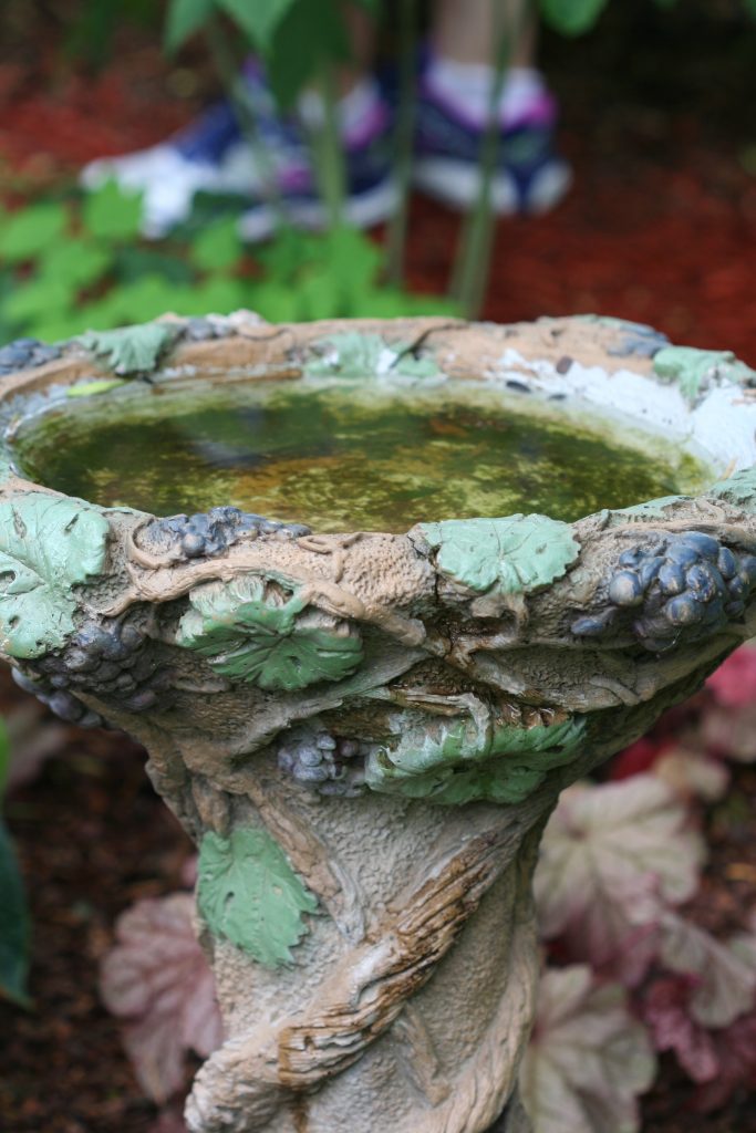 The pretty details on this birdbath make it a true garden centerpiece.