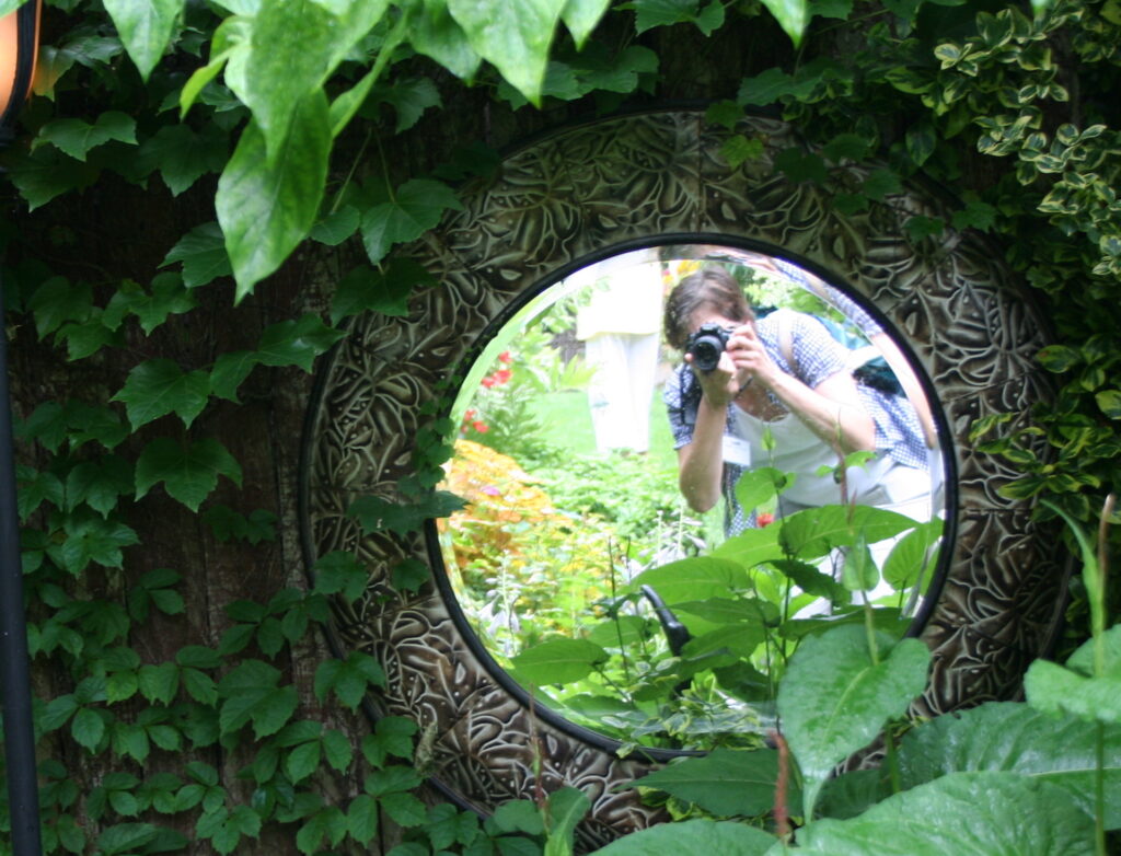 gardener taking photo in mirror